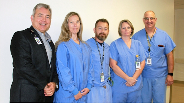 Left to Right: Skip Gjolberg, President; Surgical Technologists: Sue Tenney, Robert Goodwin, and Beatrice Mayle;  Kevin Stingo, Manager, Perioperative Services